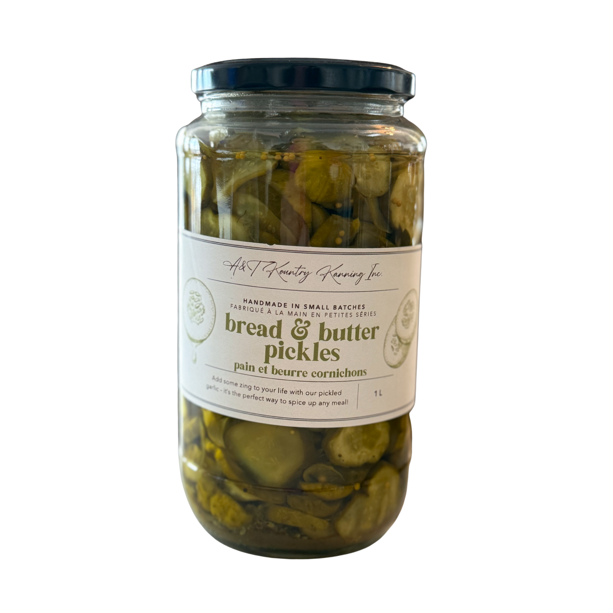 Jar of bread and butter pickles with a label on a white background.
