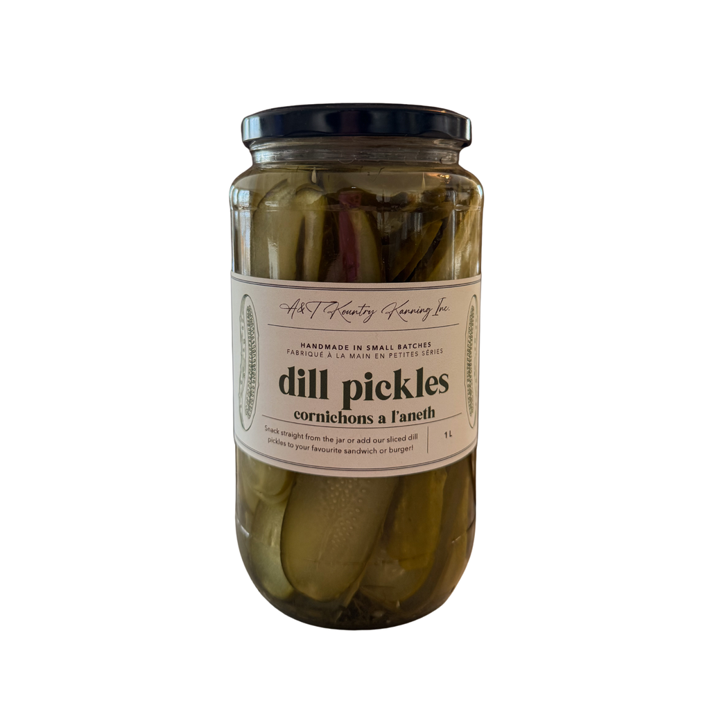 Jar of dill pickles with a label on a white background.