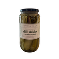 Jar of dill pickles with a label on a white background.