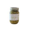 Jar of zucchini relish with a label on a white background.